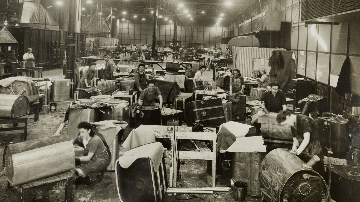 grayscale photo of people sitting on chair