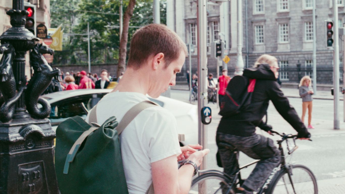 man wearing green backpack