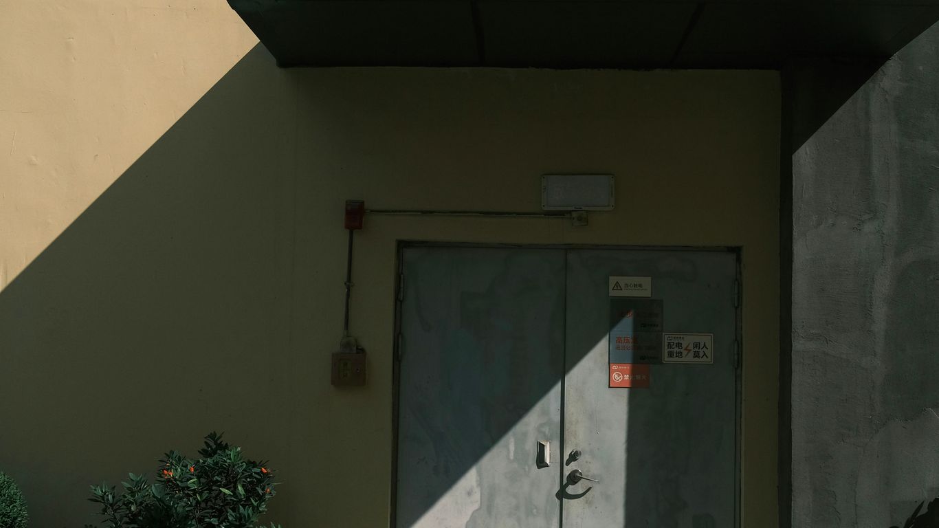 a door with a sign on it in front of a building