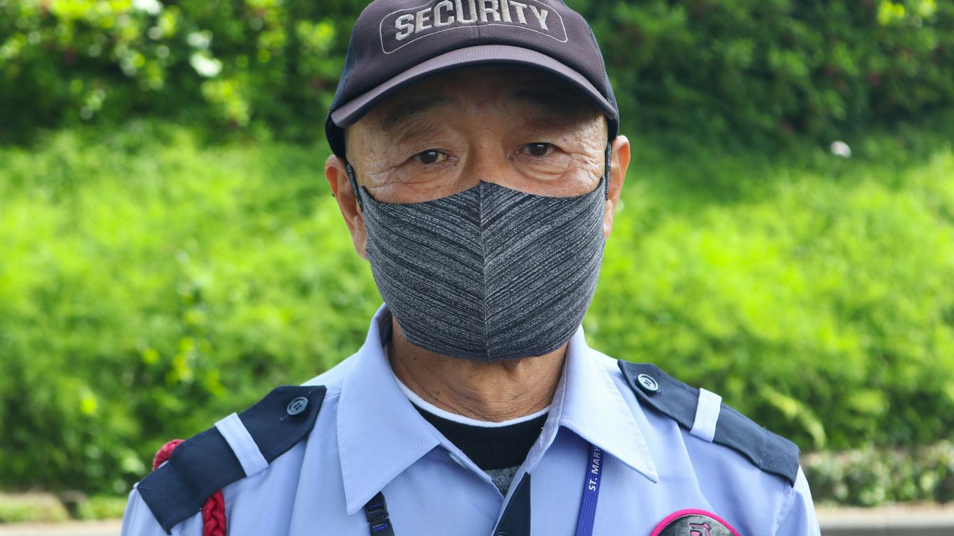 a man wearing a hat and a uniform