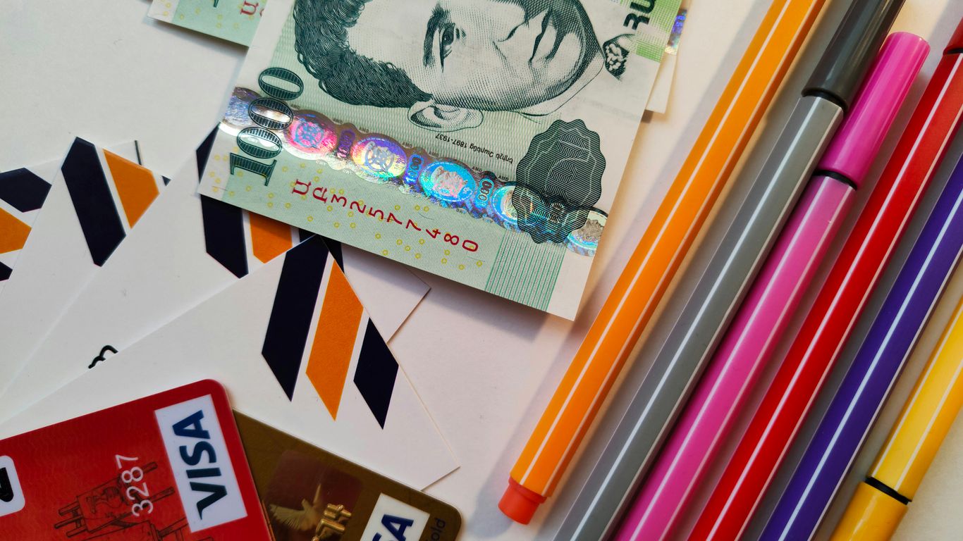 a pile of different colored pencils sitting on top of a table