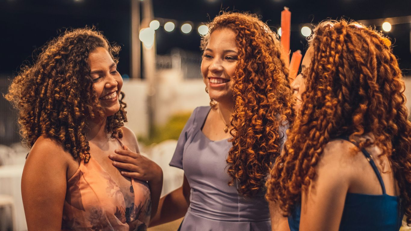 a group of women standing next to each other