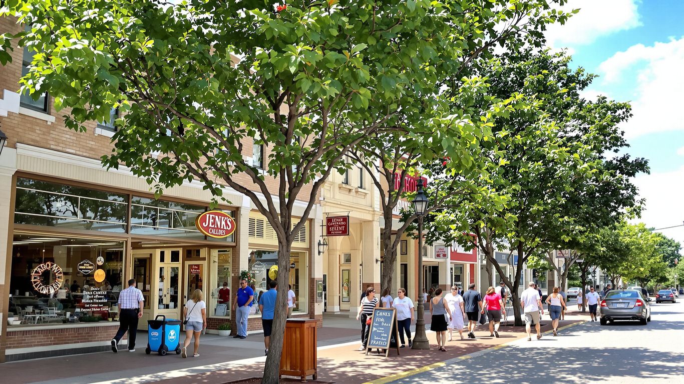 Jenks, OK street with storefronts and trees.