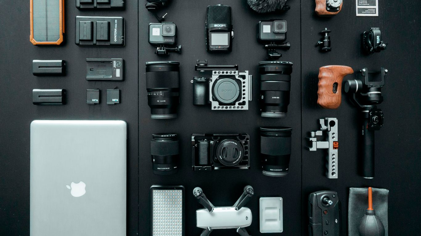 silver MacBook beside battery charger