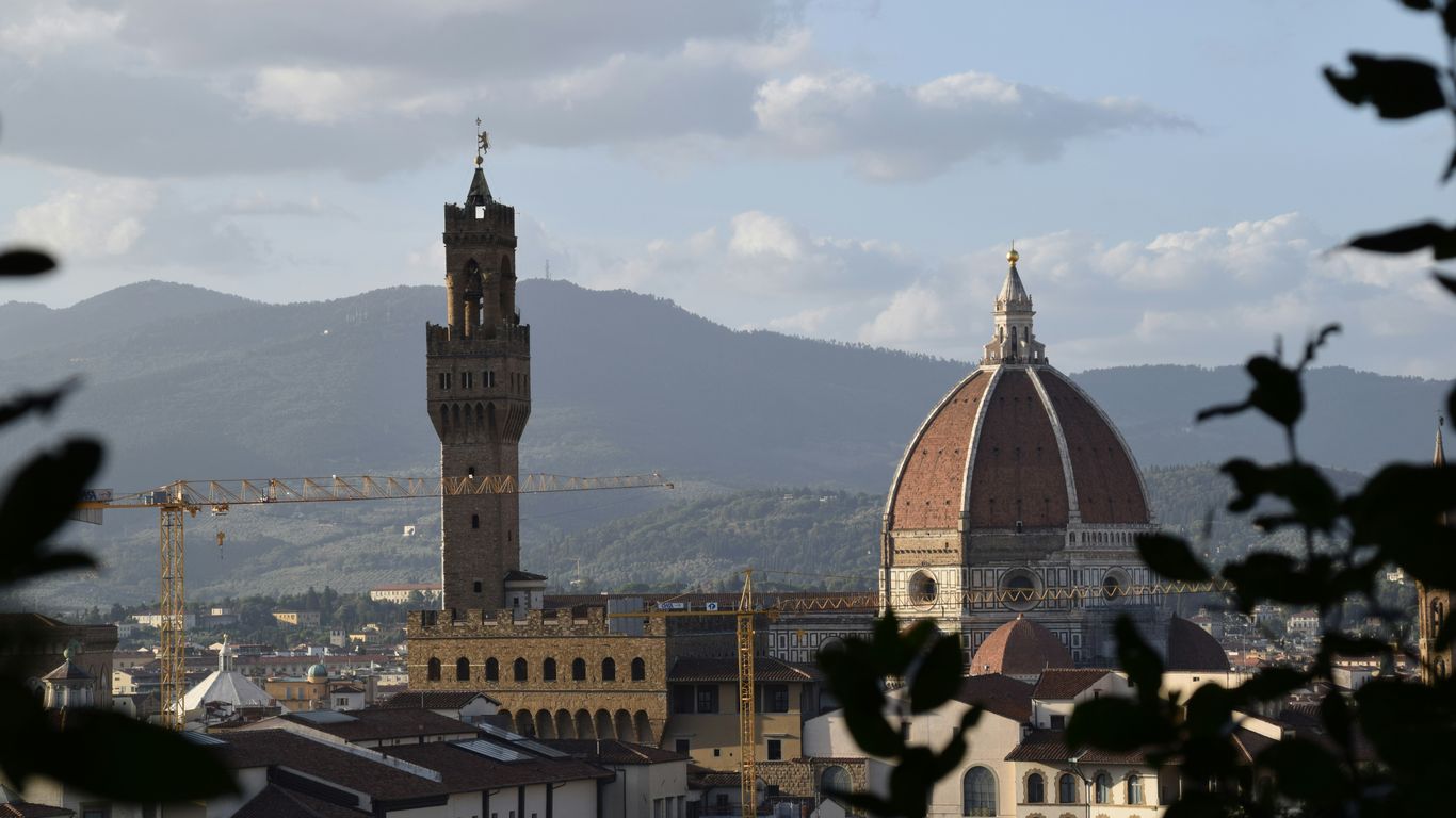 a tall tower with a clock on top of it