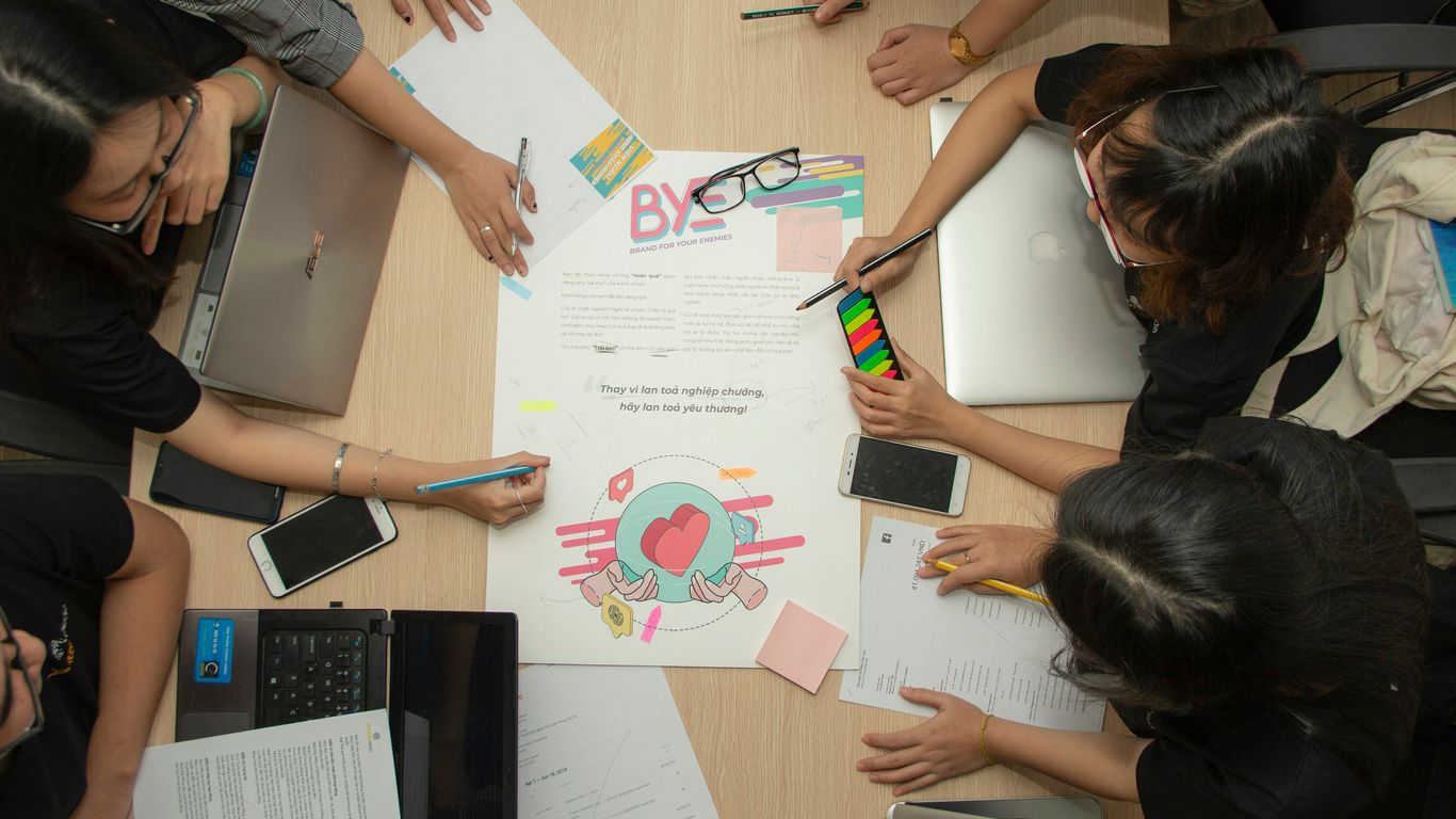 people having meeting beside table