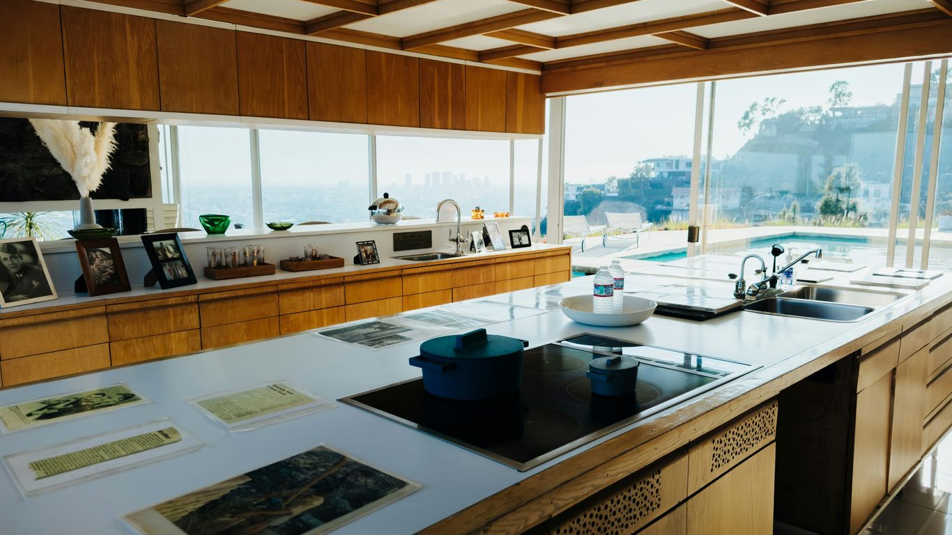 a kitchen with a sink and a stove top oven