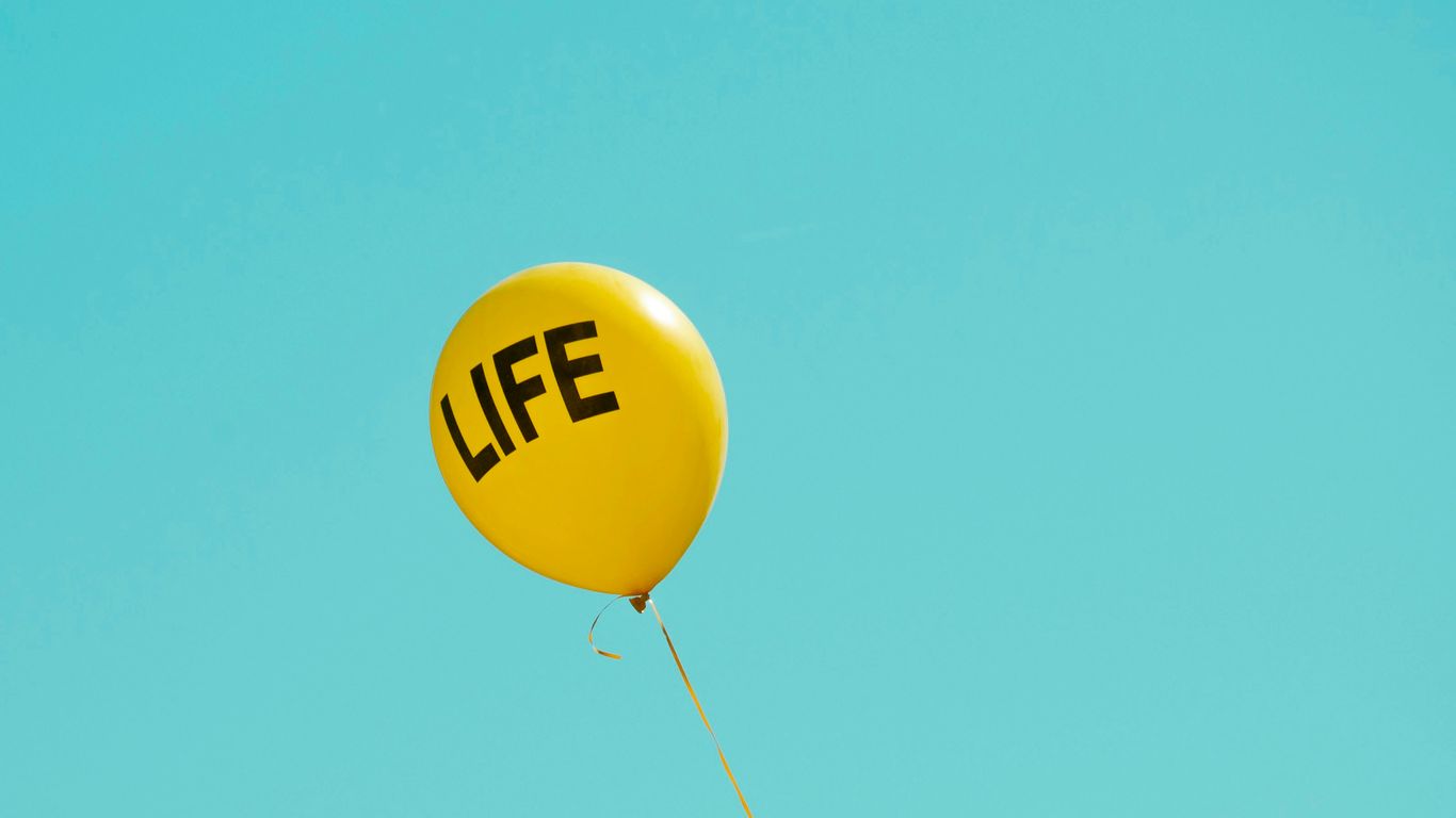 yellow life-printed balloon