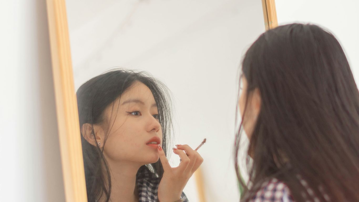 a woman looking at another woman