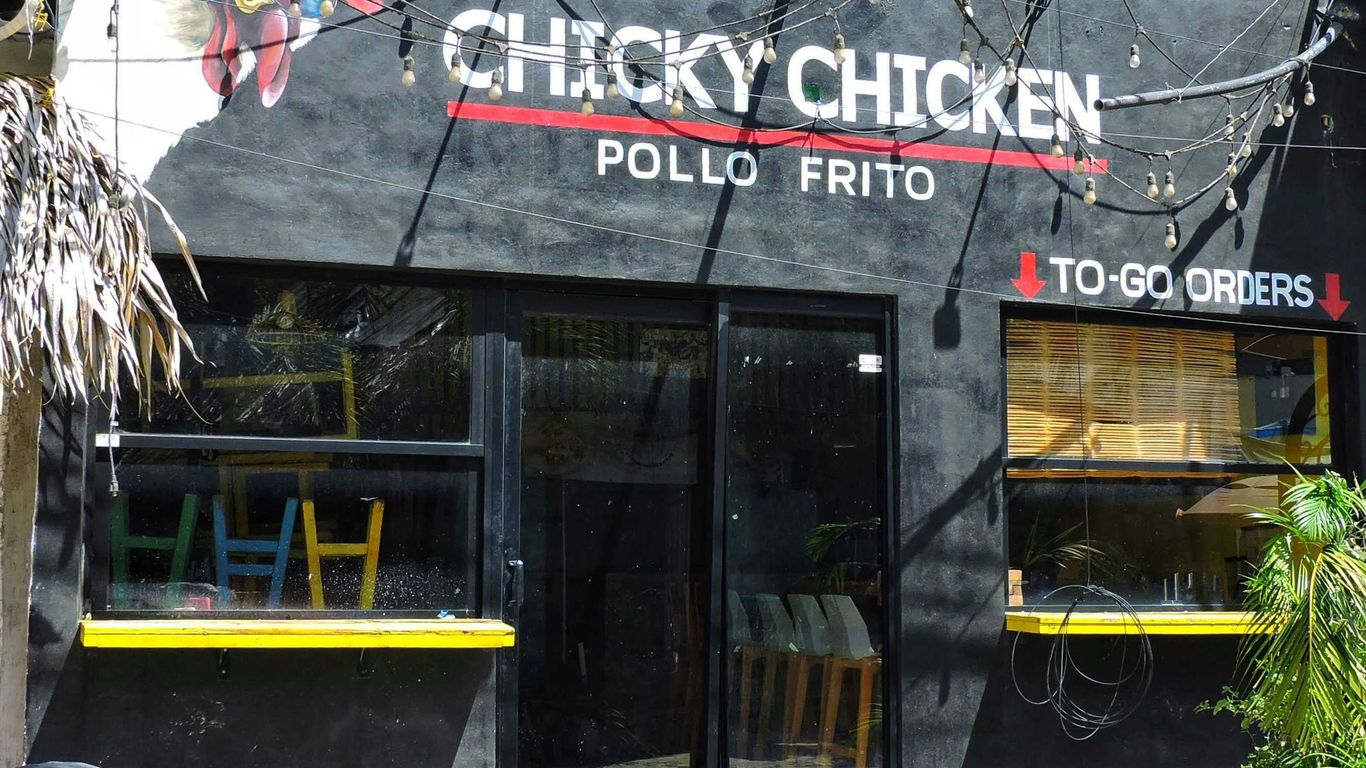A restaurant called chicky chicken in a city