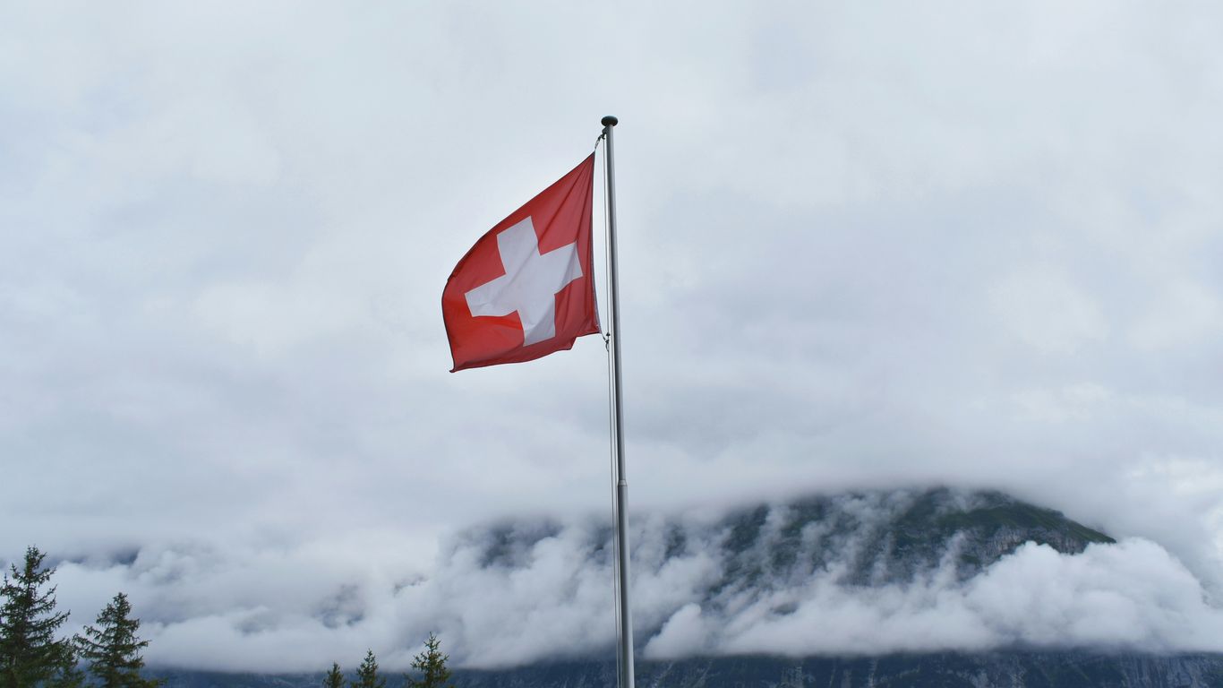 Switzerland flag during cloudy day