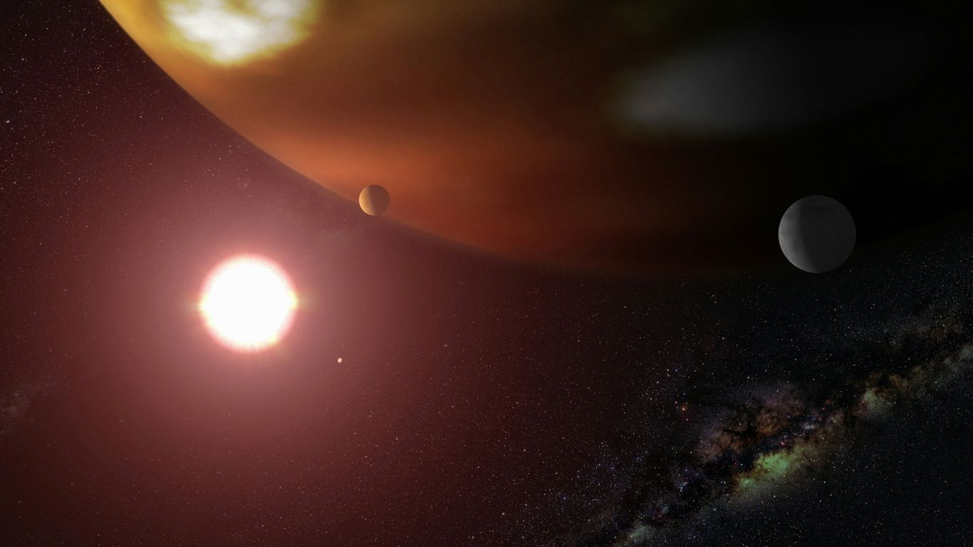 a solar system with two planets in the background