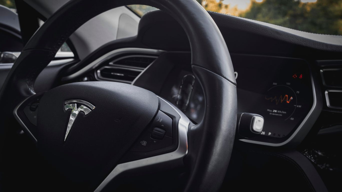 close-up photo of black vehicle steering wheel