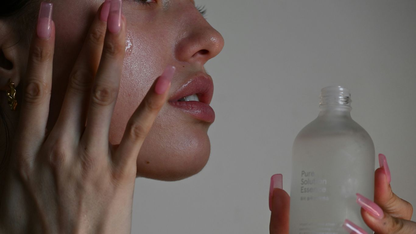 a person holding a bottle