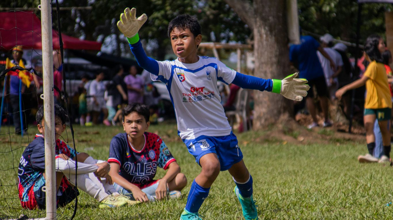 a group of young men playing a game of soccer