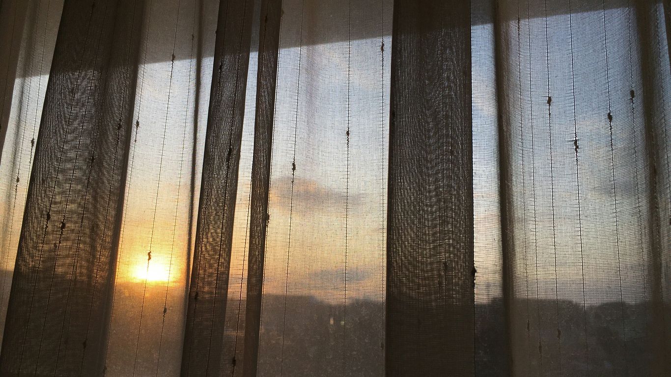 white and brown window curtain