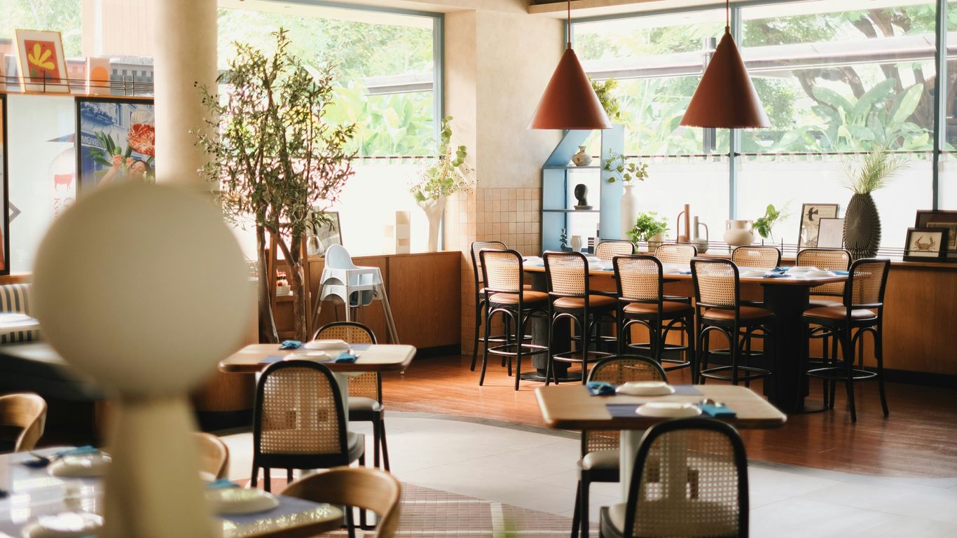 A restaurant filled with lots of tables and chairs