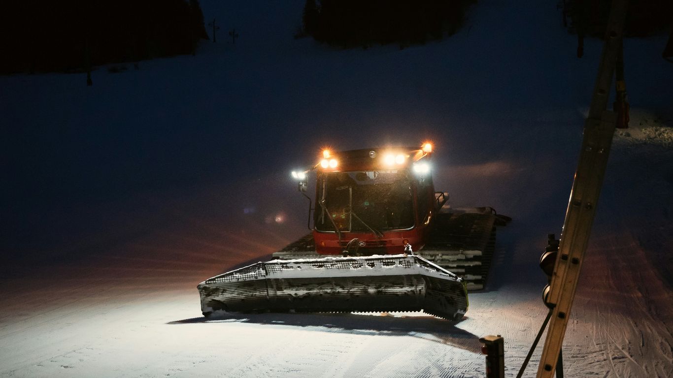 lighted fire on snow covered ground during night time