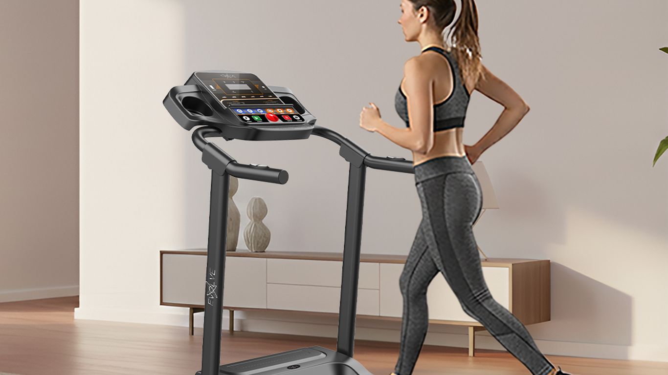 A person runs on a treadmill in a modern living room.