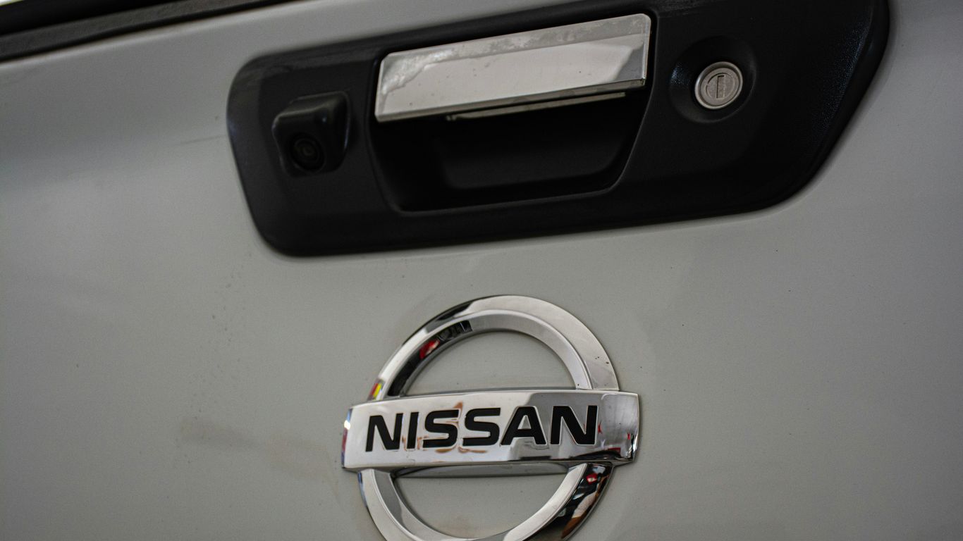 a close up of a nissan emblem on a car