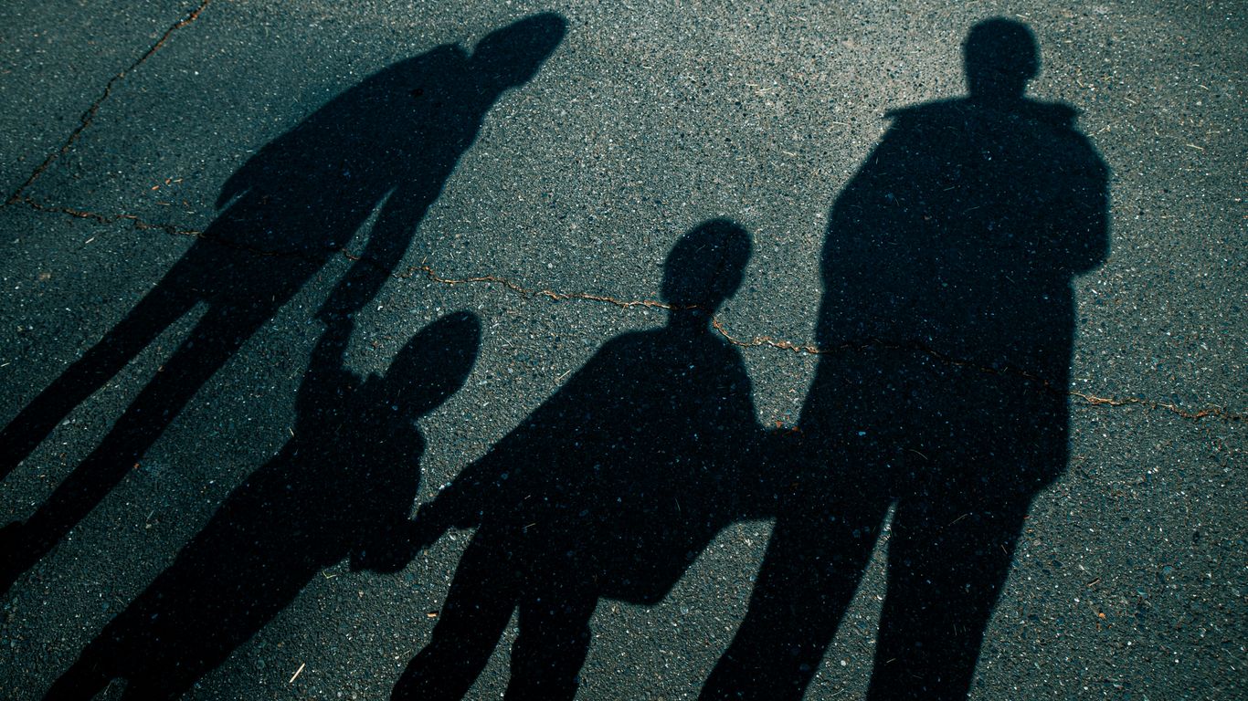 2 person walking on the street