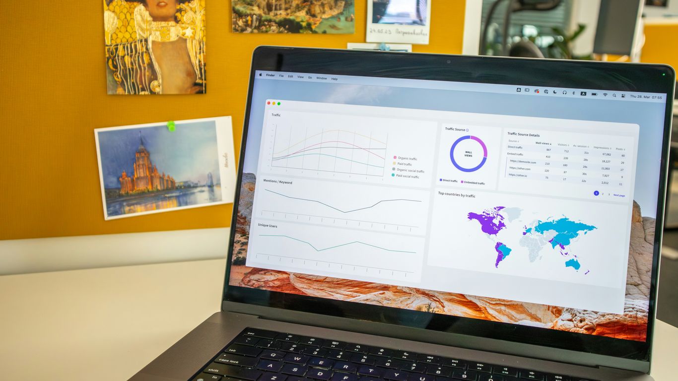 a laptop computer sitting on top of a desk