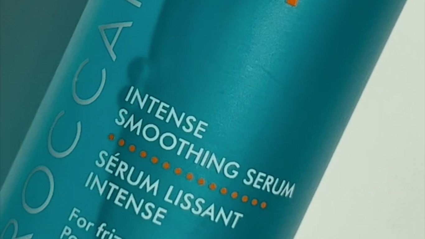 Bottle of Moroccanoil Intense Smoothing Serum for frizz control.