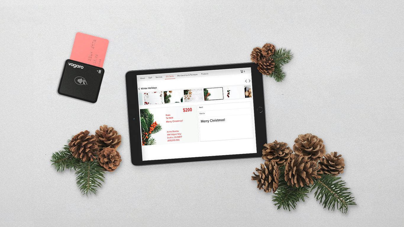 a tablet computer sitting on top of a table next to pine cones