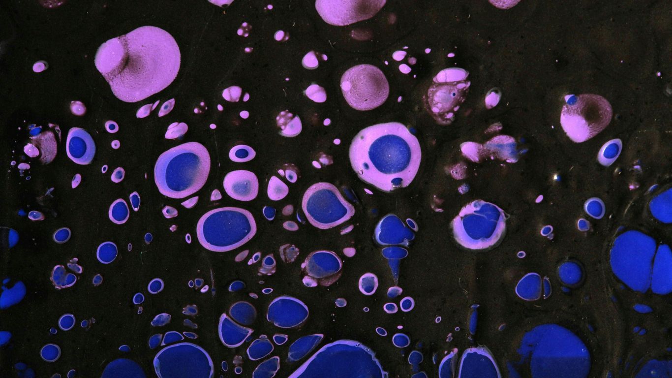 A close up of blue and black bubbles