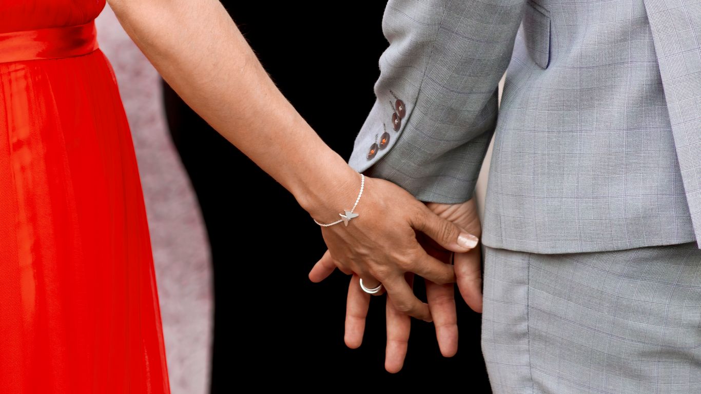 man and woman holding hands