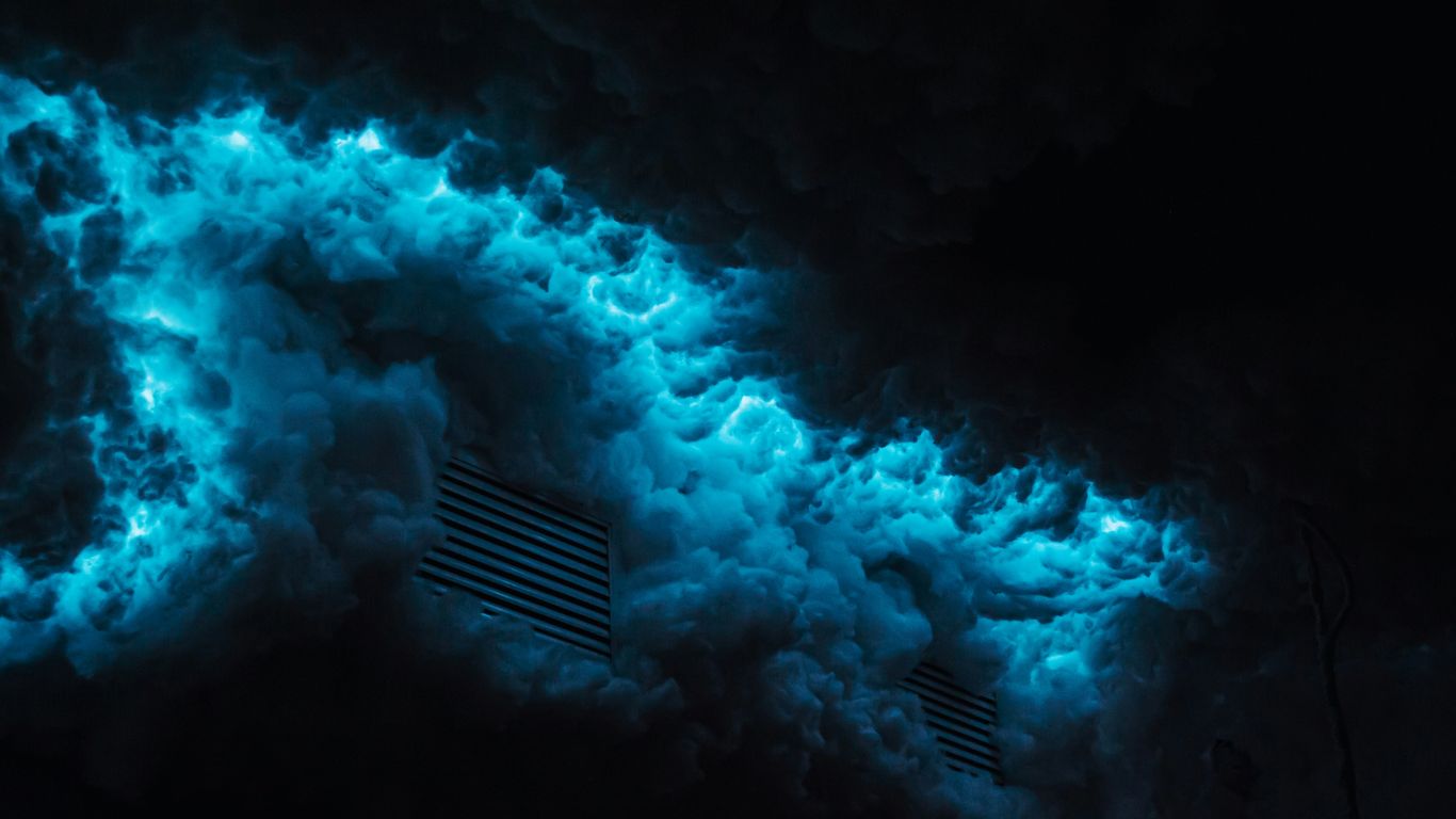 a dark room with a blue light coming out of it