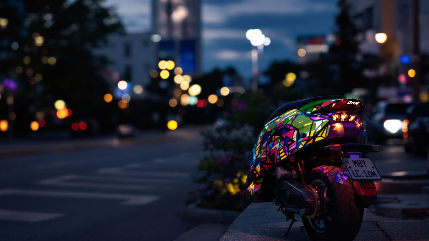 Electric scooter on a city street at dusk.