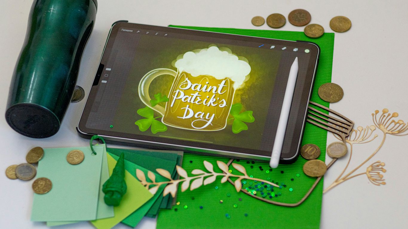 black tablet computer on green table