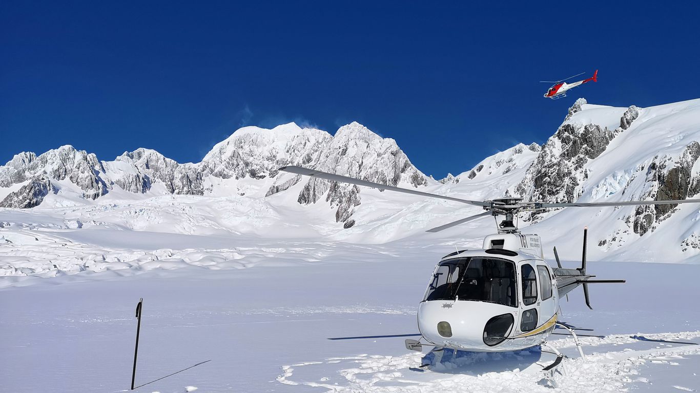 white helicopter on ice field