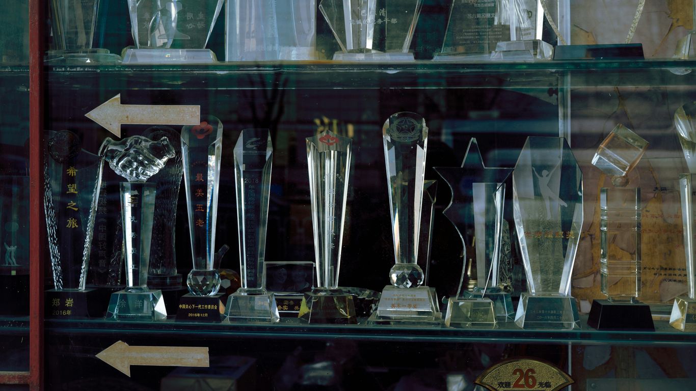 a display case filled with lots of trophies