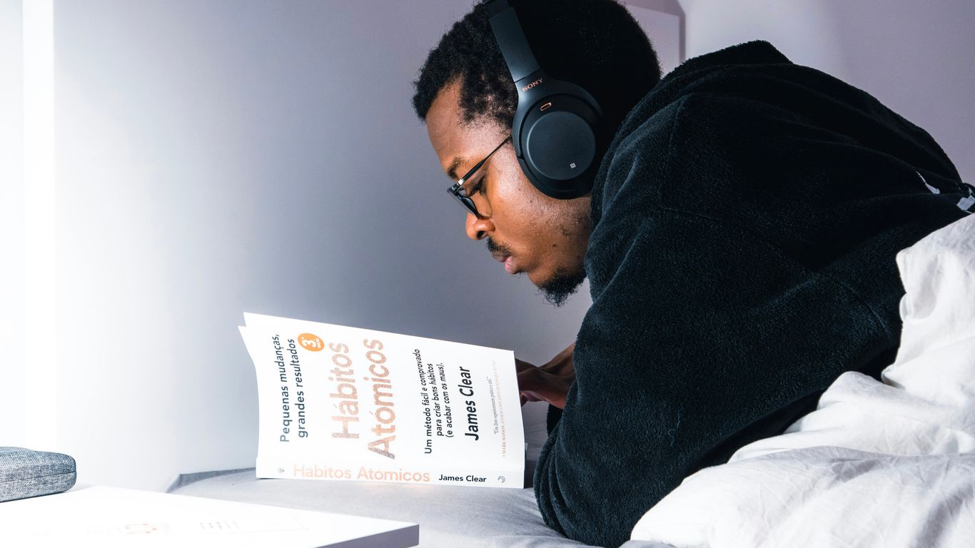man in black jacket wearing black headphones