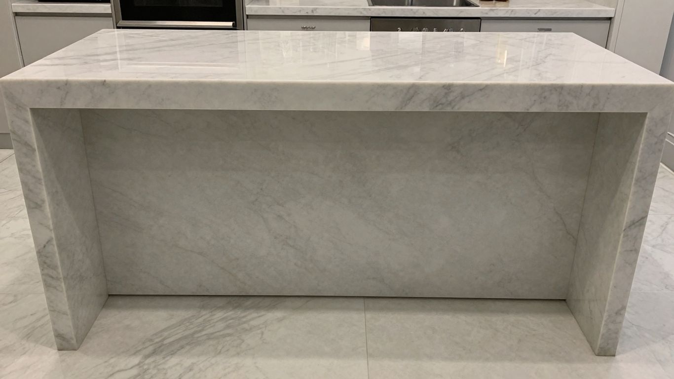 Polished Thassos white marble interior with elegant countertops and flooring.