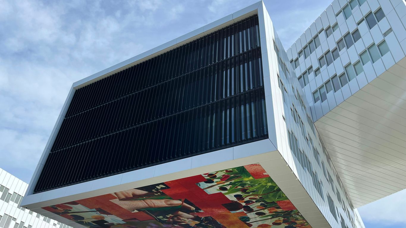a tall building with a mural on the side of it