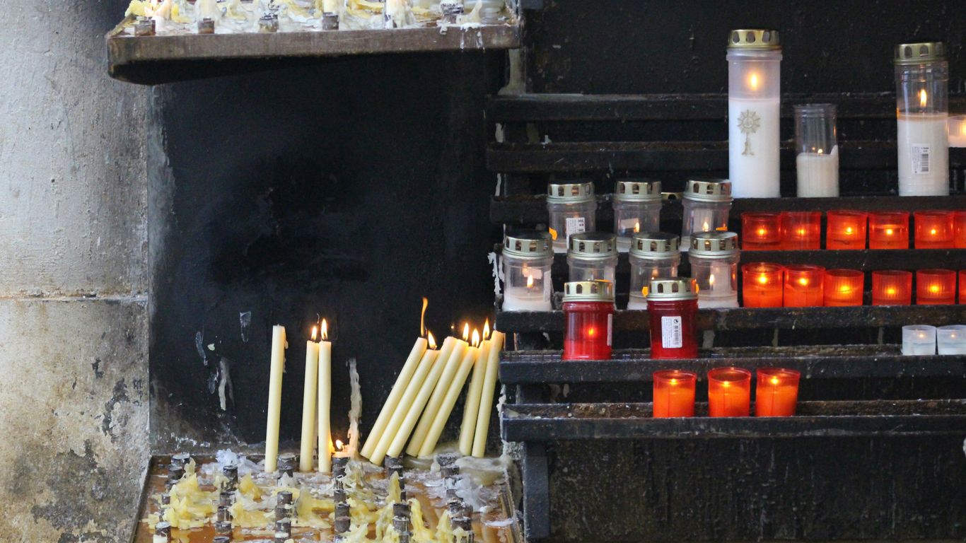 white candles on black table
