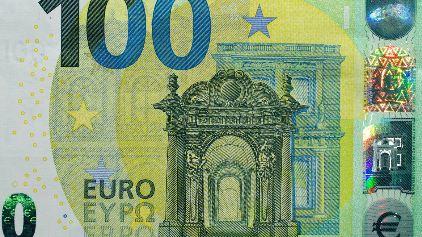 A paper money bill with a picture of a building on it