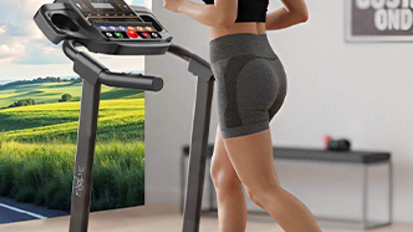 Person running on a treadmill with a scenic view on the screen.