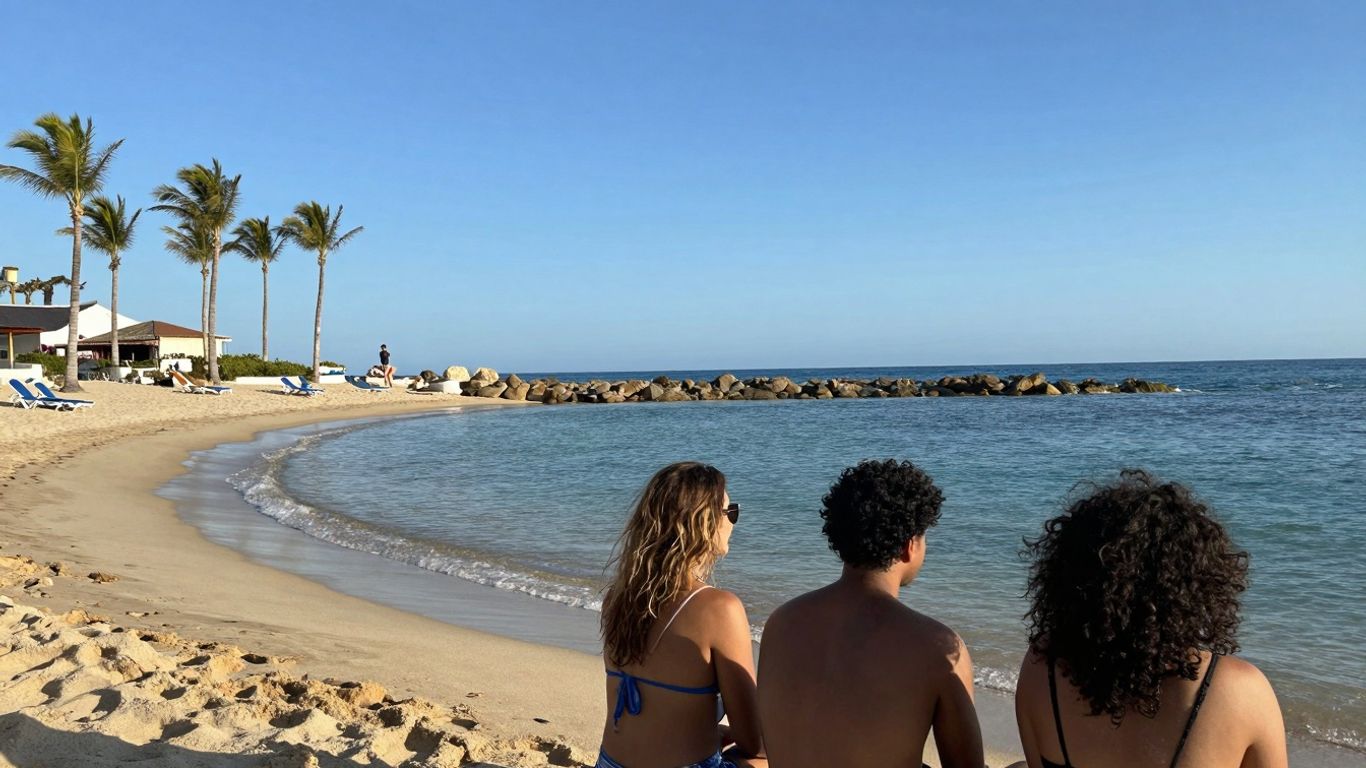 Cabo beach with calm turquoise water and palm trees.