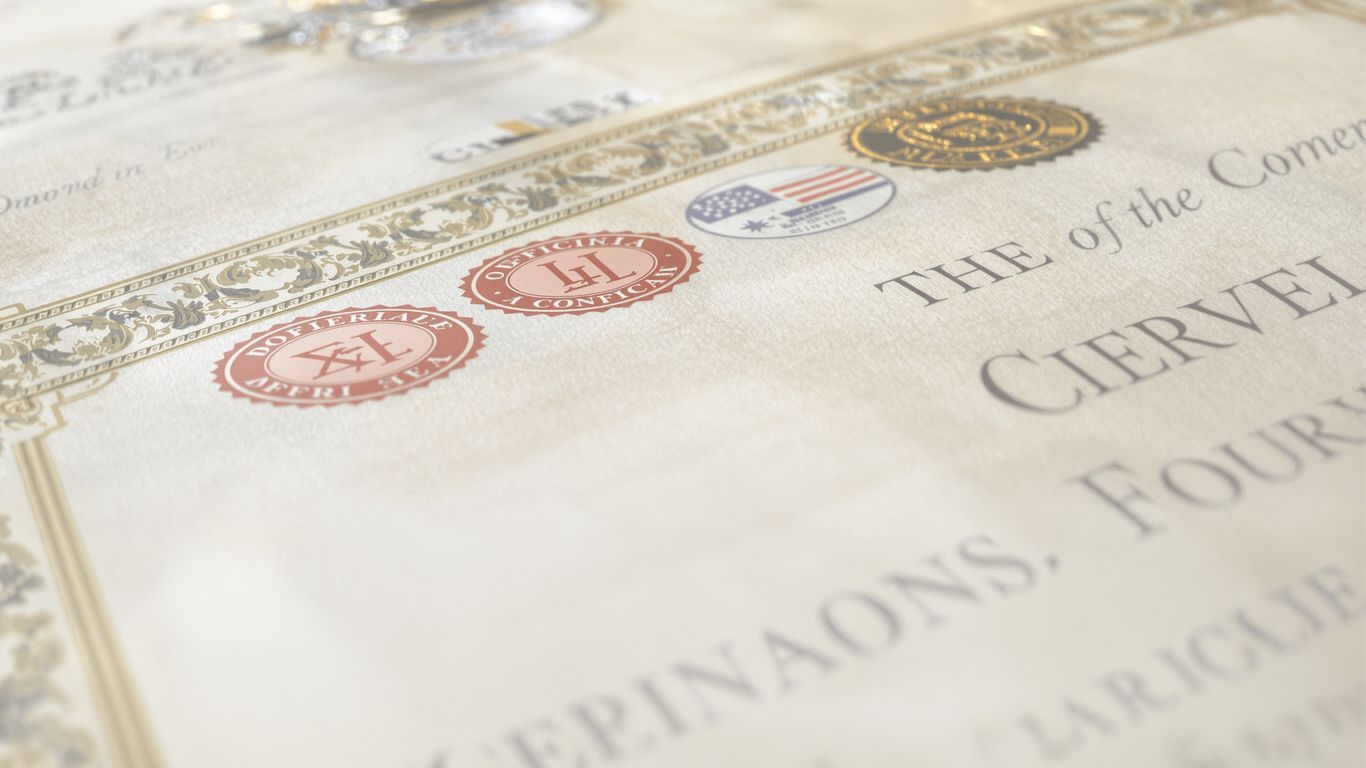 Official document with seals and ornate borders.