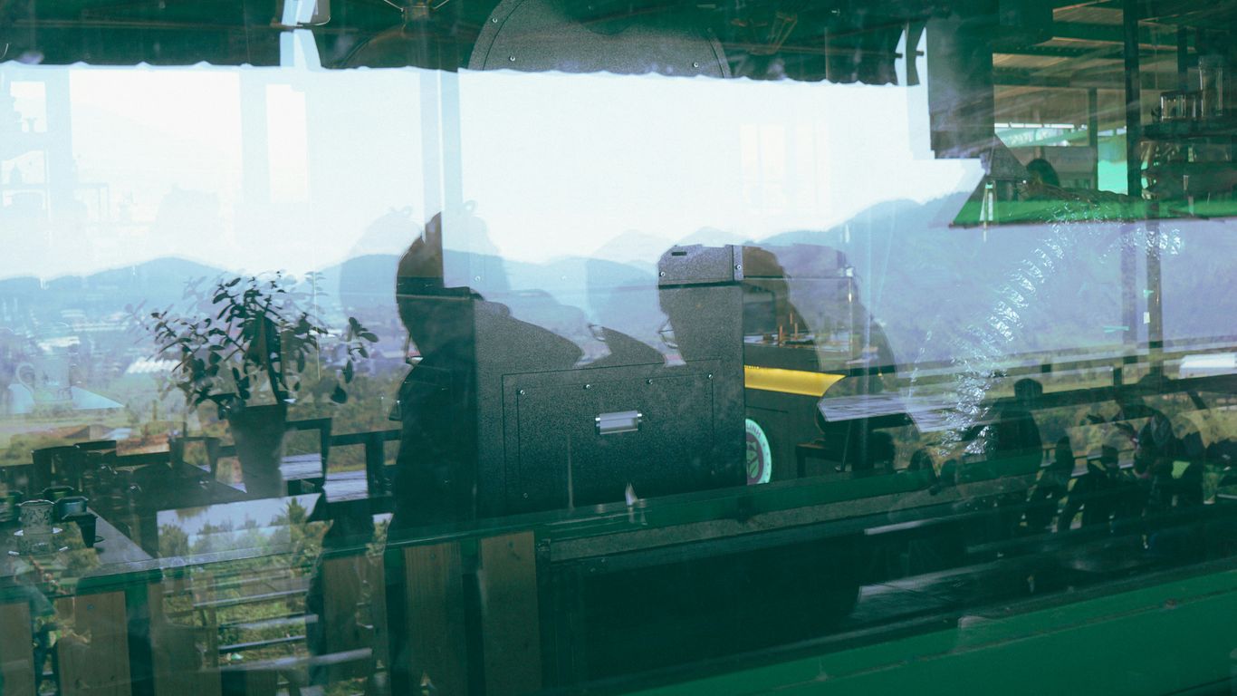 a reflection of a person in a window