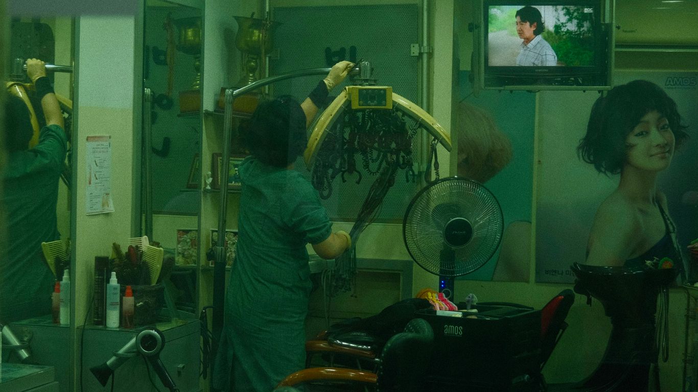 a woman in a hair salon getting her hair done