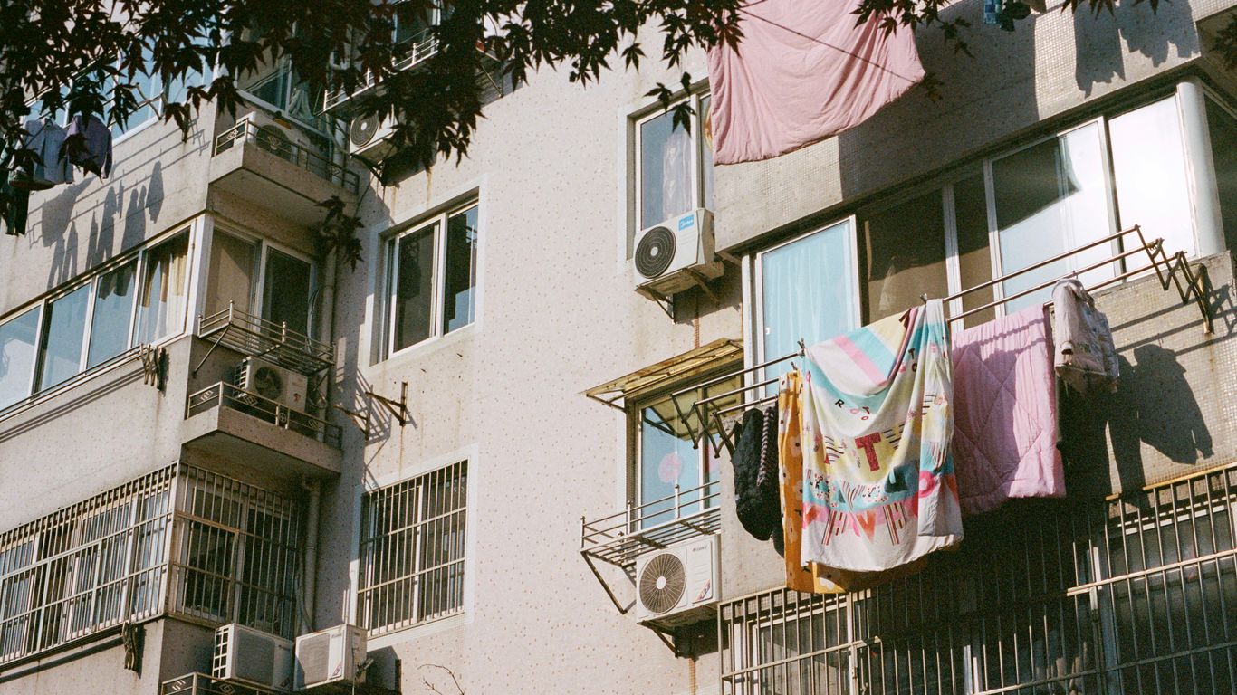 An apartment building with clothes hanging out to dry