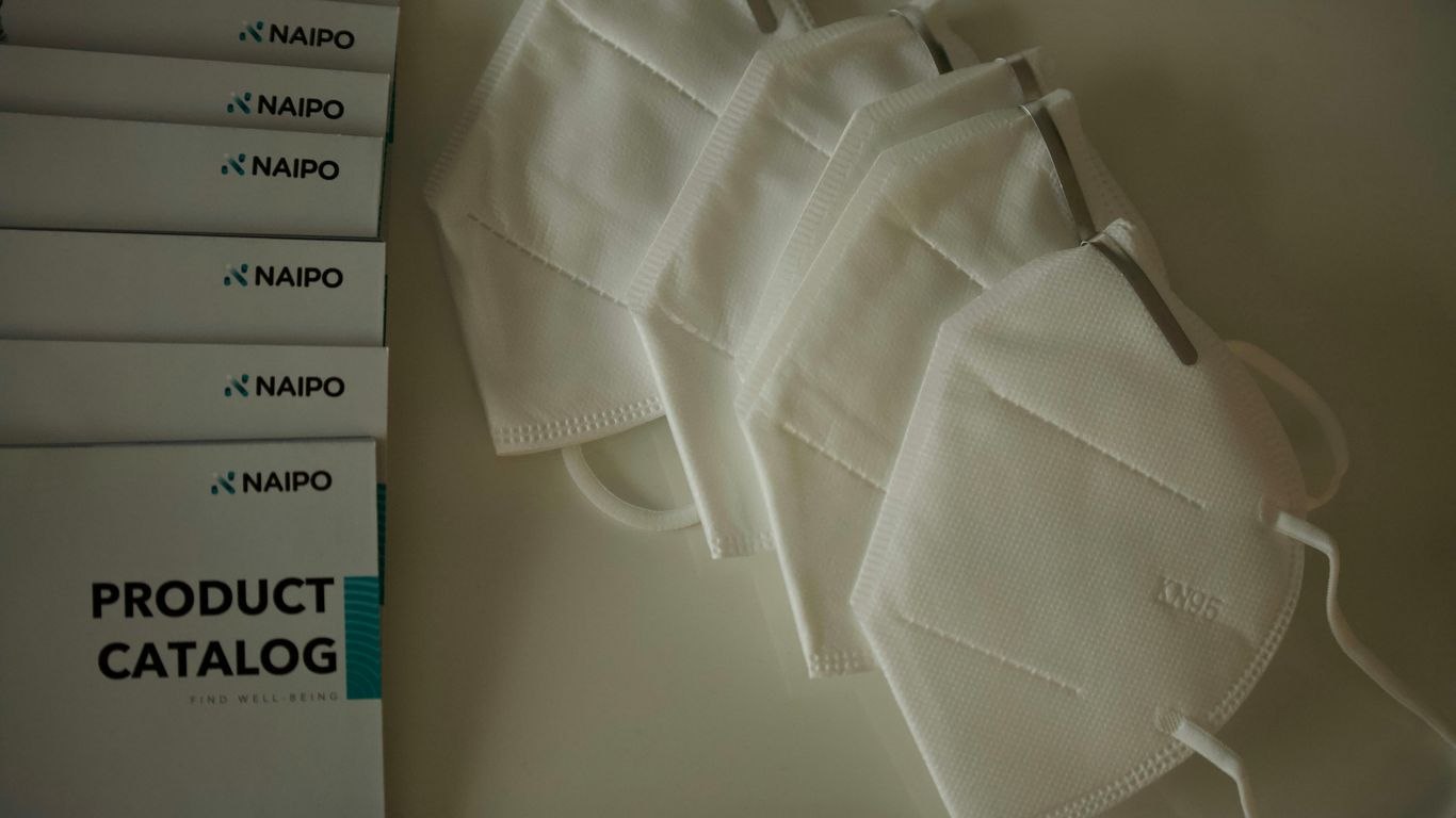 white polo shirt on white table