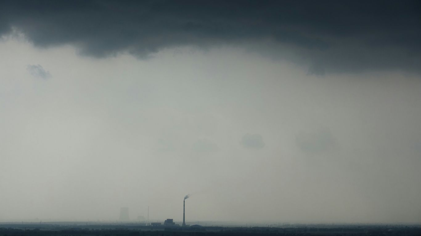a very dark sky with some clouds in the background