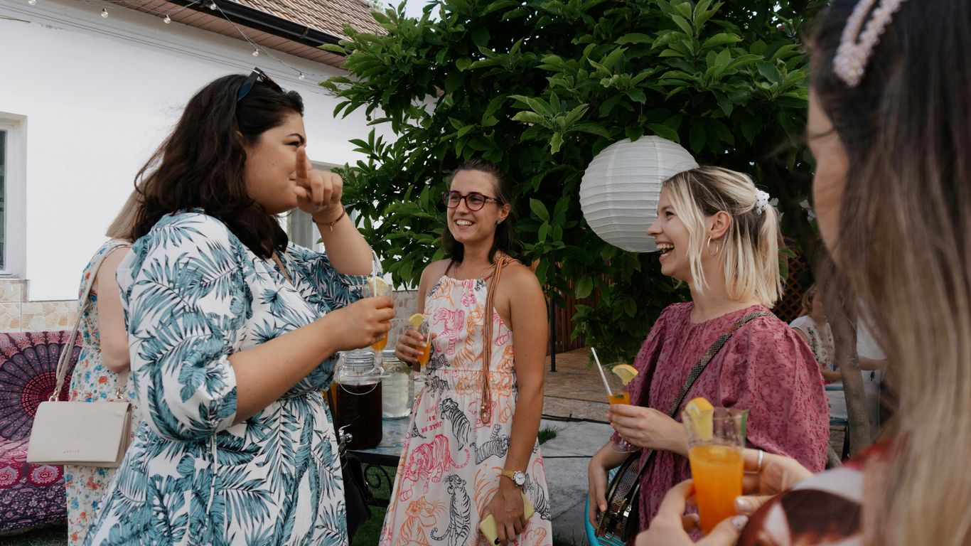 a group of women standing next to each other