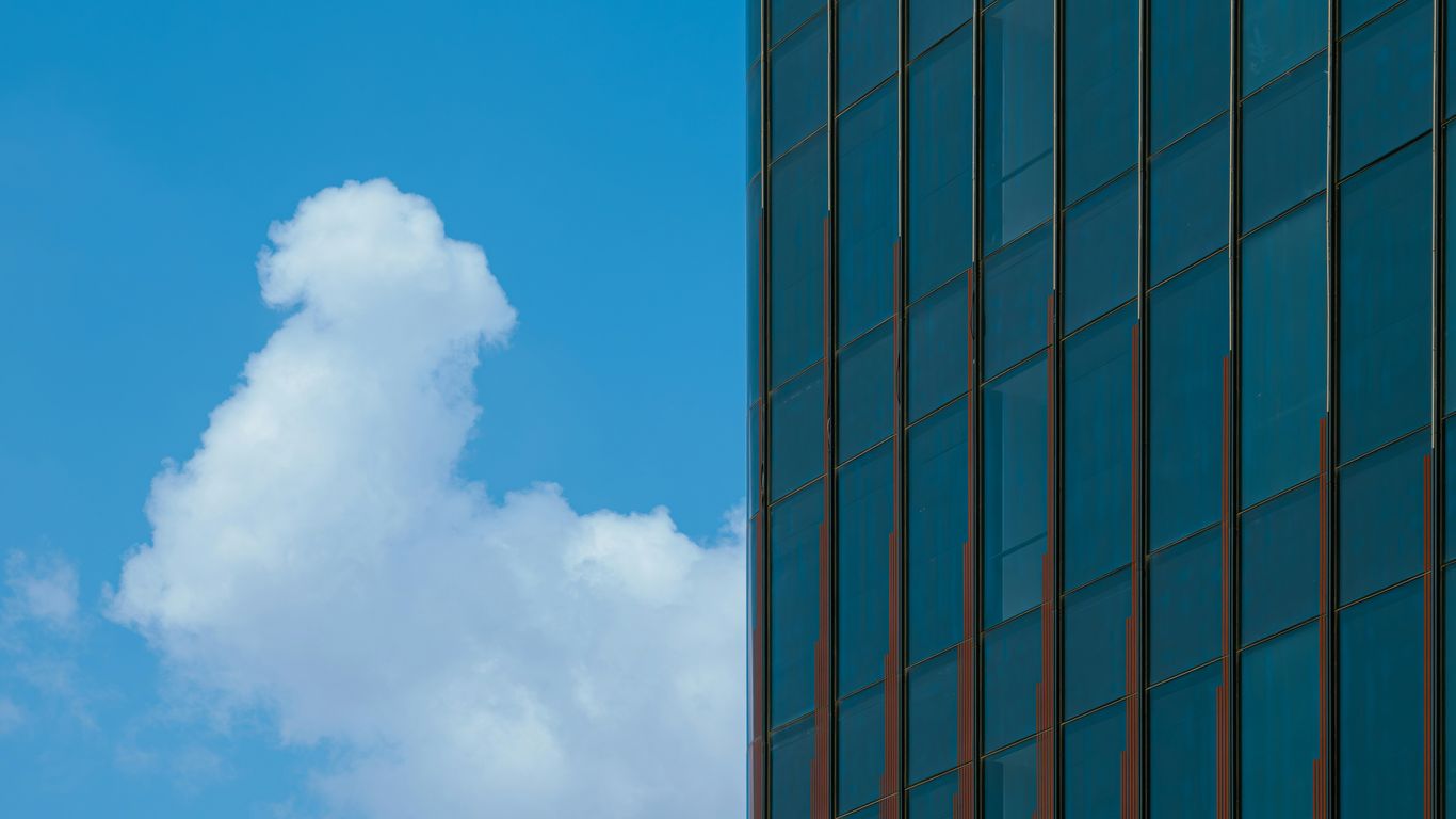 A tall building with a sky in the background